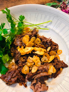 A picture of Japanese Wagyu Beef (fry with garlic and butter soy sauce).