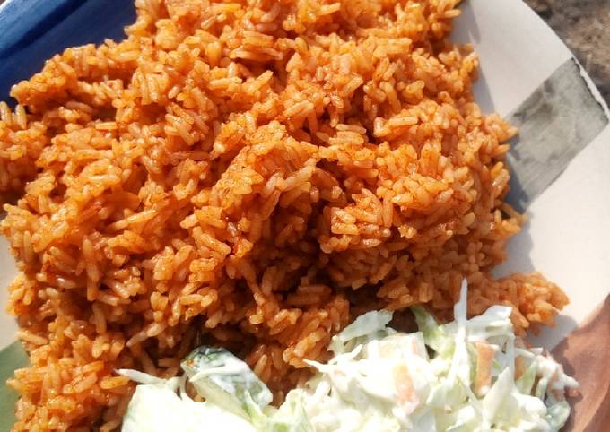 Jollof rice and salad Recipe by Hajara - Cookpad