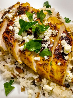 A picture of Pan-seared chicken with warm spices and feta.