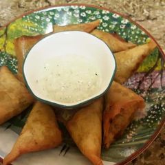 A picture of Paneer bhurji stuffed samosa.