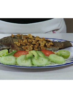 Una foto de Mojarra al ajillo