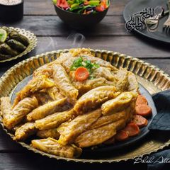 A picture of Stuffed_cabbage_in_olive_oil_pomegranate_sauce.