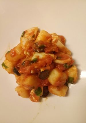 A picture of Seppie e patate squid and potatoes.
