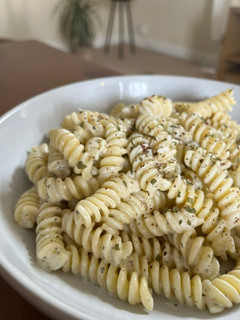 A picture of Lebanese style pasta with yogurt and garlic sauce.