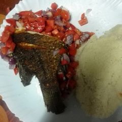 A picture of Fried fish with kachumbari.