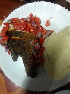 A picture of Fried fish with kachumbari.