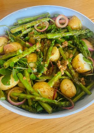 A picture of Potato salad with asparagus.