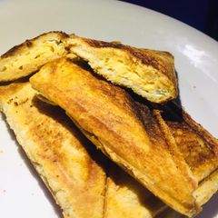 A picture of Egg filled toasted bread.