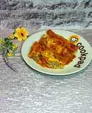 Каннеллони с мясным фаршем, запечённые под томатным соусом и сыром