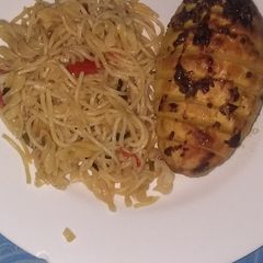A picture of Pasta mashup(spaghetti and fusilli)with baked potatoes.