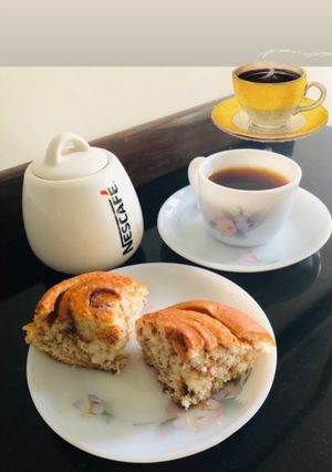 A picture of Cinnamon Rolls with Black Coffee.