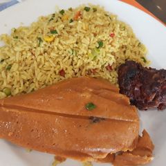 A picture of Fried rice,fried goat meat.