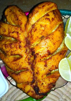 A picture of Baked Chicken tikka with roghni Naan.
