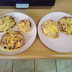 A picture of Flap-Jack's with minced bacon topped with melted cheese 😋😋.