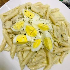 A picture of Low gluten spicy pasta with Lemon garlic, mushroom top with egg and Parmesan cheese 😉🥒🍋🧄🥚🌶.
