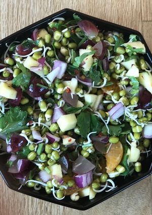 A picture of Sprouted moong with fruits.