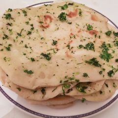 A picture of Homemade Garlic Parsley Naan Bread.