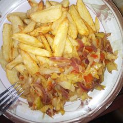 A picture of Fried potatoes and cabbage sauce.