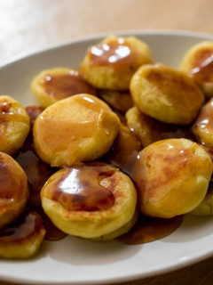 A picture of Potato Mochi with sweet soy sauce.