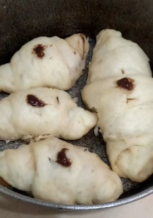 A picture of Croissants with chocolate spread 🥐🥐🍫.