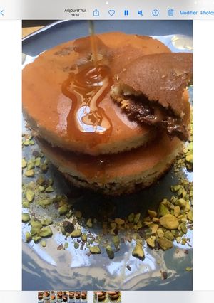 Une photo de Pancakes🥞 🍥🍯nutella 🍫🌰🥜☕️