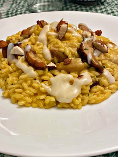 Foto di Risotto allo zafferano e porcini con crema di parmigiano