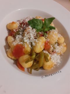 A picture of Gnocchi with Green Beans, Fresh Tomato, and Cacio-Ricotta.