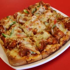 A picture of Cheesey square pizza.