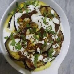 A picture of Baked eggplant with masala yogurt.