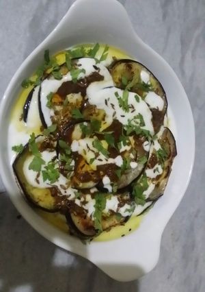 A picture of Baked eggplant with masala yogurt.