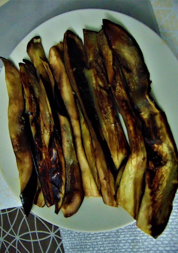 Una foto de 🍆Berenjenas al ajo 🧄y a la miel 🍯