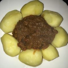 A picture of Beef Curry with Boiled Potatoes.