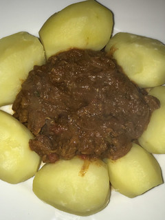A picture of Beef Curry with Boiled Potatoes.