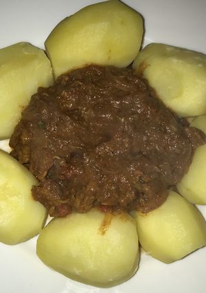 A picture of Beef Curry with Boiled Potatoes.