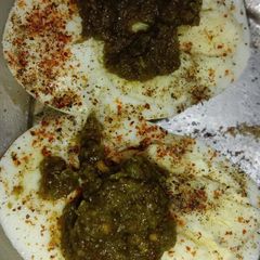 A picture of Boiled eggs with chutney.
