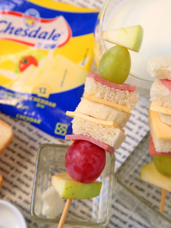 A picture of Fruit, Cheese, and Ham Sandwich Skewers.