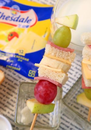 A picture of Fruit, Cheese, and Ham Sandwich Skewers.