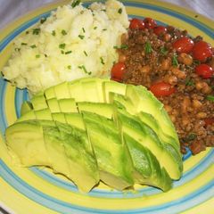 A picture of Mashed potatoes in coconut cream, minced beef & beans.