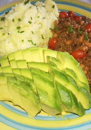 A picture of Mashed potatoes in coconut cream, minced beef & beans.