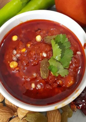 A picture of Tomato Chutney with nuts.