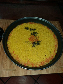 Una foto de Arroz sequito del caldo de cocido