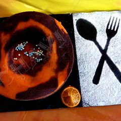 A picture of Eggless orange and chocolate cake.