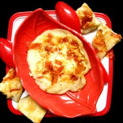A picture of Rice Tomato Paneer Uttapam.