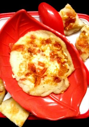 A picture of Rice Tomato Paneer Uttapam.