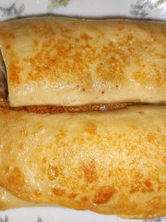 Фото Млинці з сиром, родзинками та горіхами.