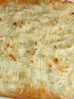 Una foto de Pastel de cordero y puré gratinado