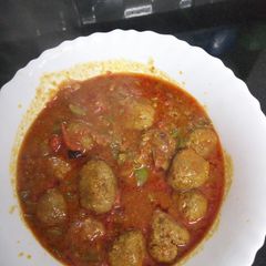 A picture of Meatballs in sauce.