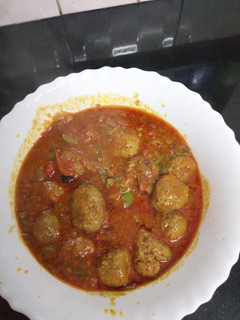 A picture of Meatballs in sauce.