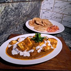 A picture of Paneer lababdar with tomato gravy.