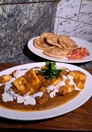 A picture of Paneer lababdar with tomato gravy.
